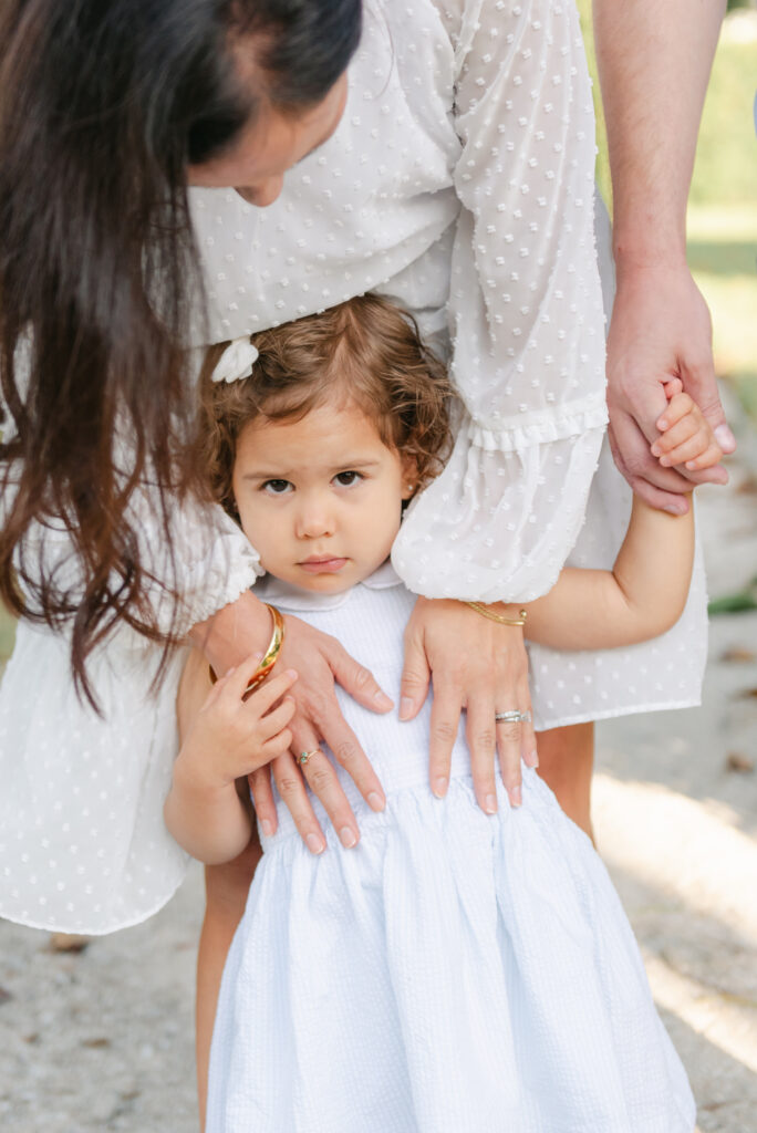 Mom looking down at little girl