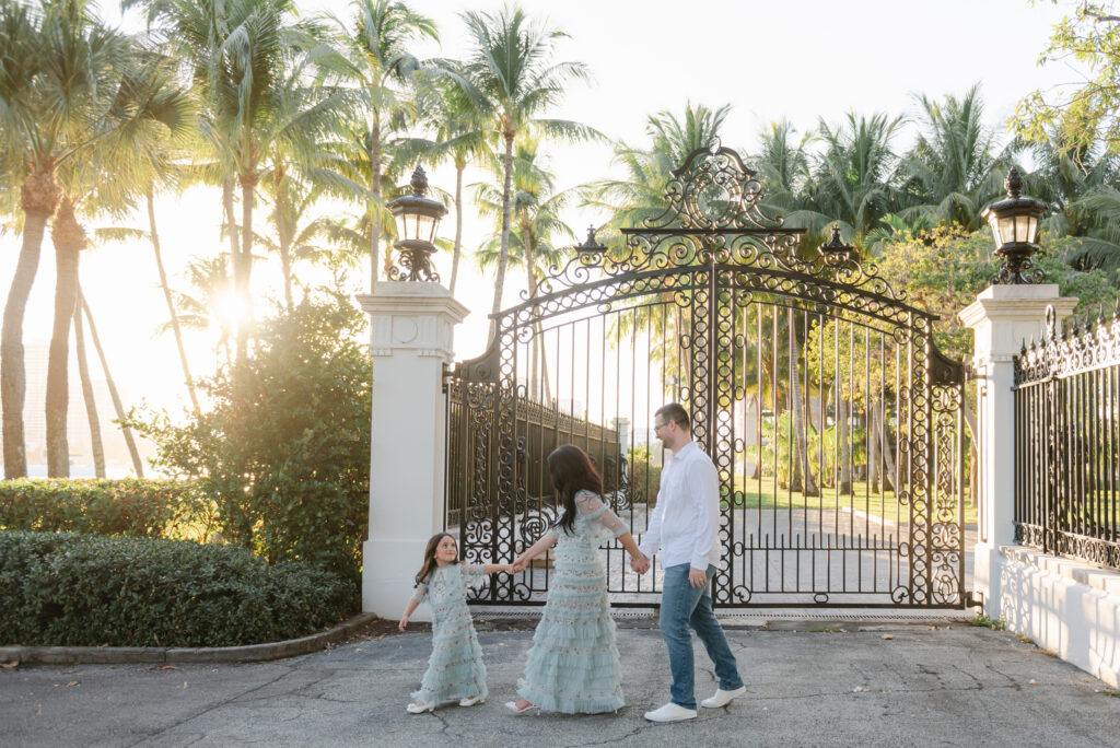 Mom, dad and daughter walking looking at each other