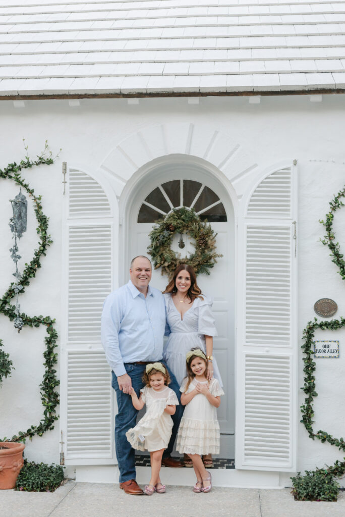 Family of four, daughter swishing dress